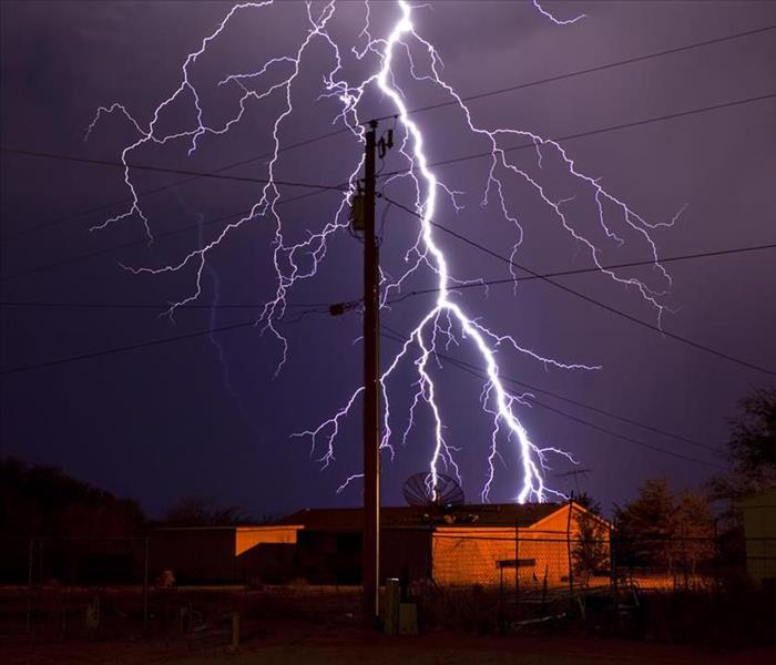  Lightning over power lines and a house