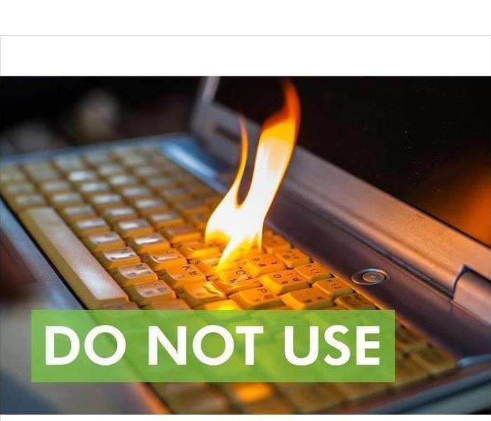 Keyboard of a computer with fire flame