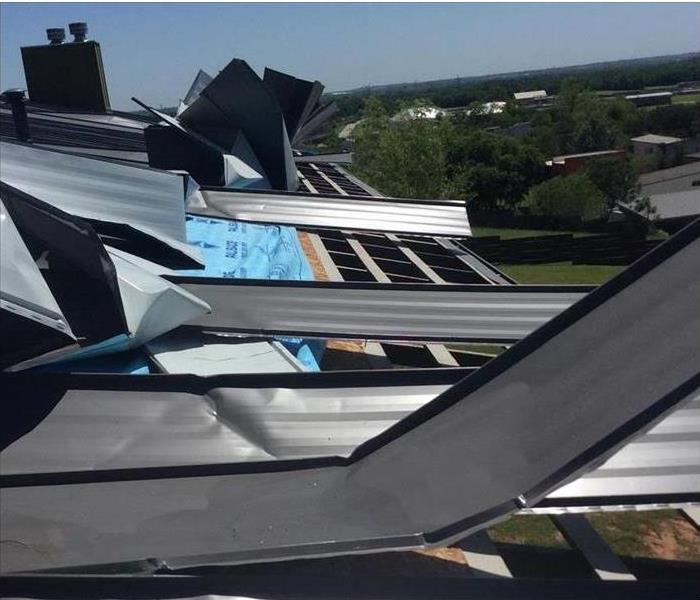 Metal sheet roofing damaged by heavy winds